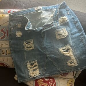 Gently worn distressed style jean skirt